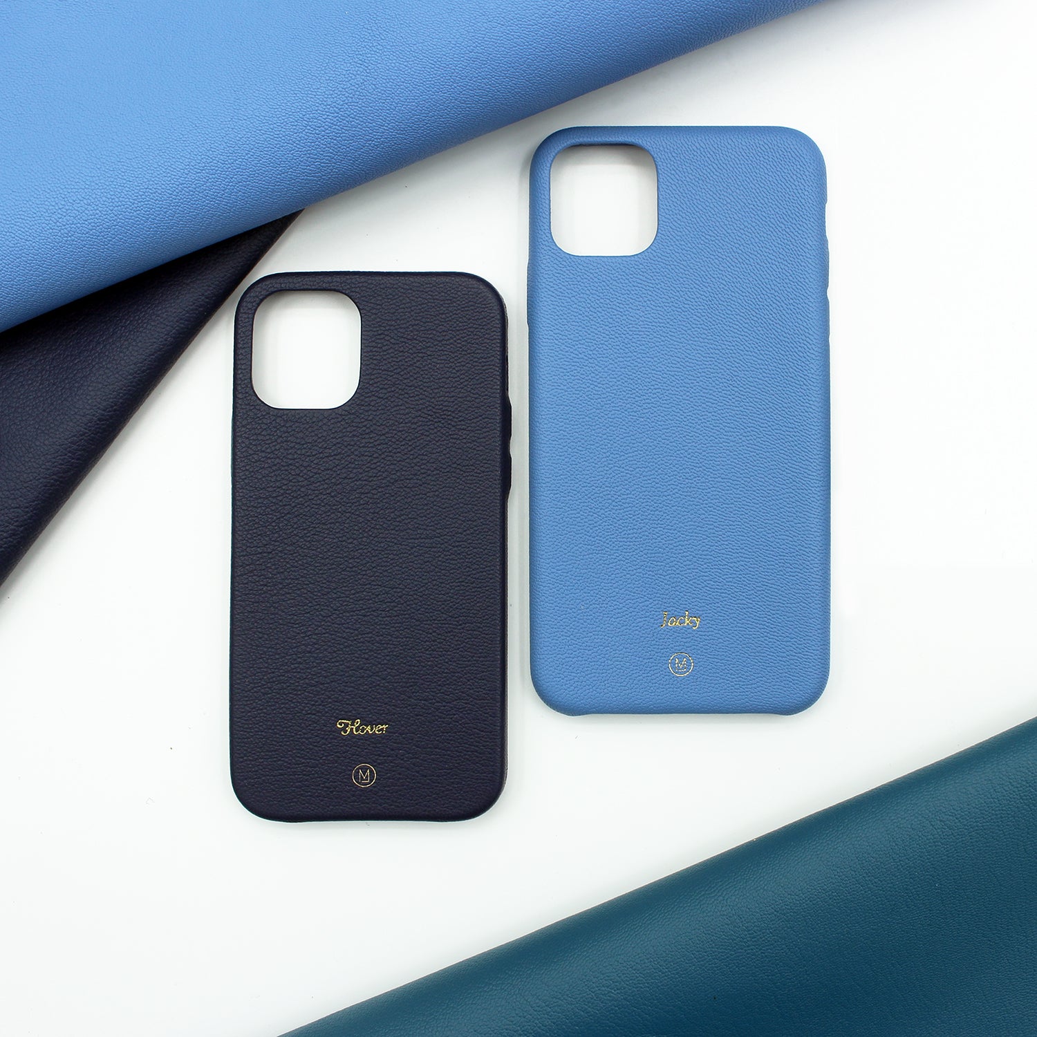 iPhone Case Bundle which includes 2 leather iPhone cases, at 15% off the original price. Different hues of blue are available. Complimentary embossing and international shipping. 